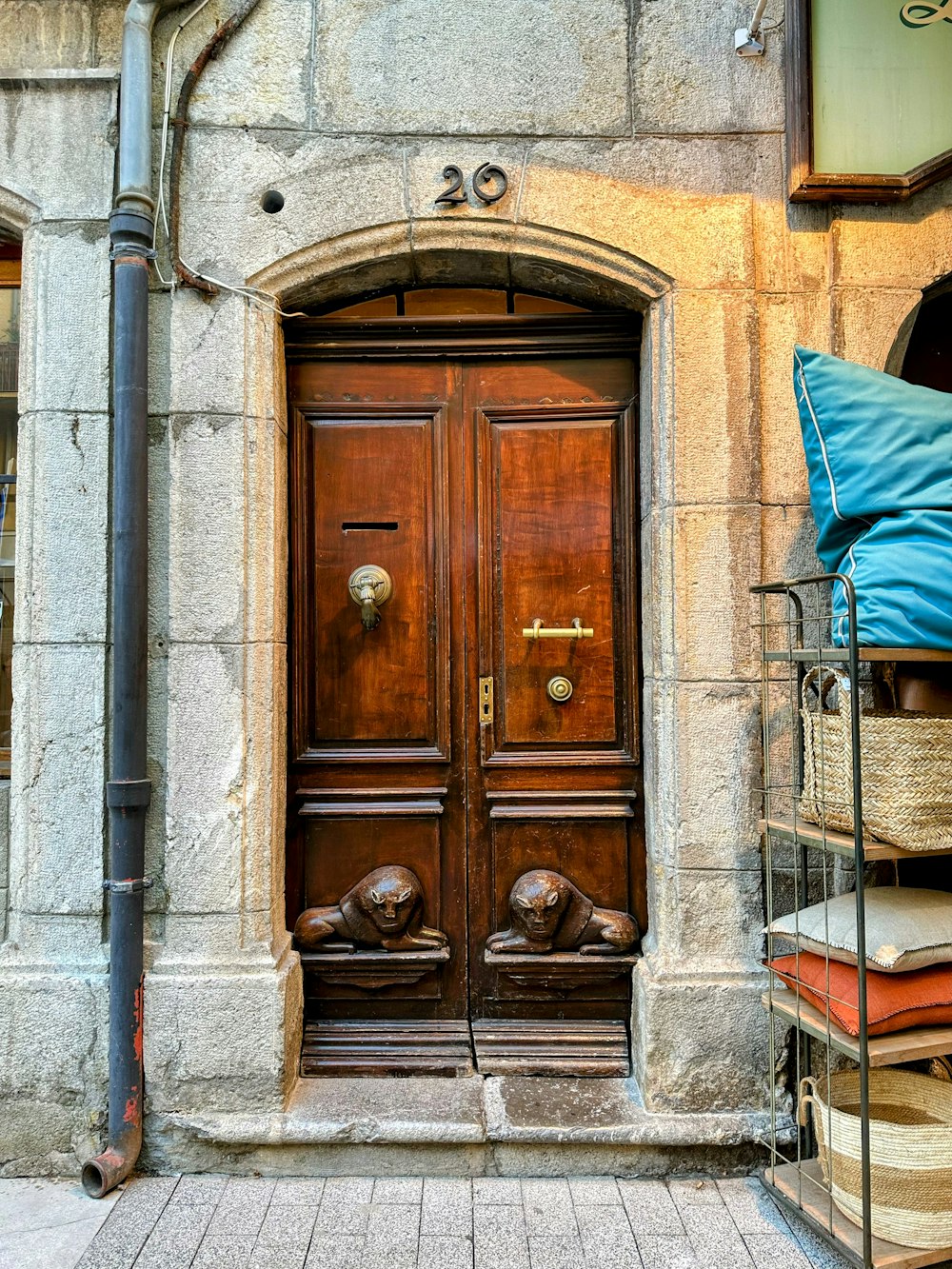 a large wooden door with a blue pillow on top of it