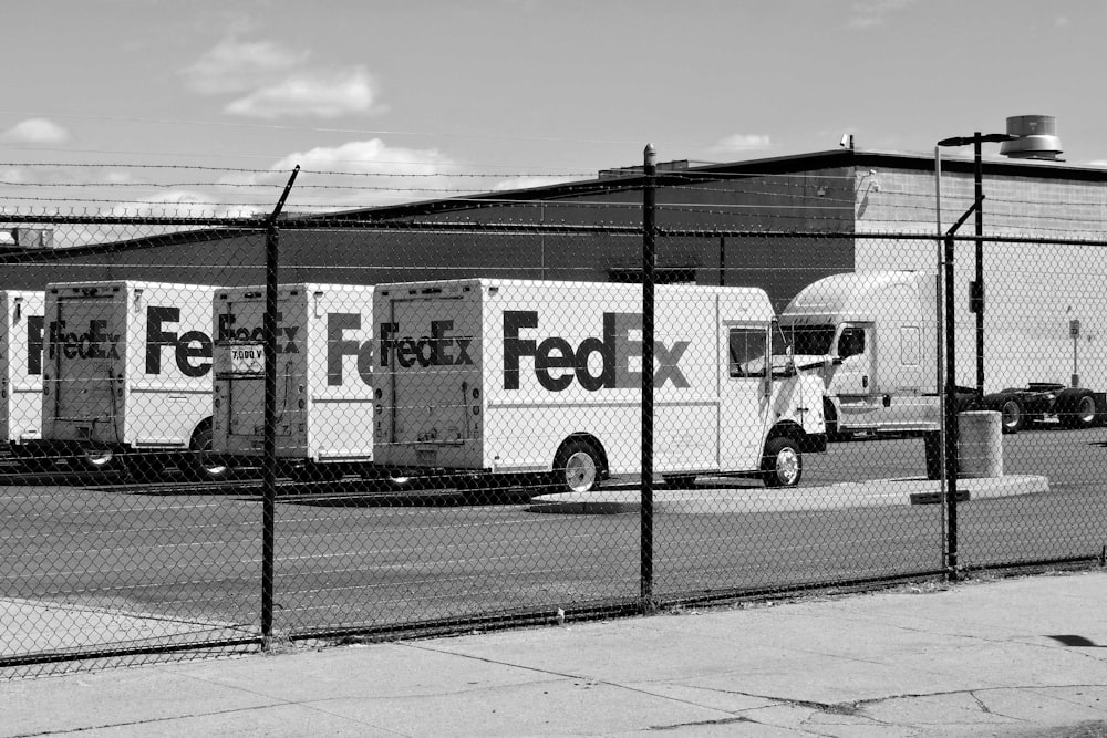 a black and white photo of a fedex truck