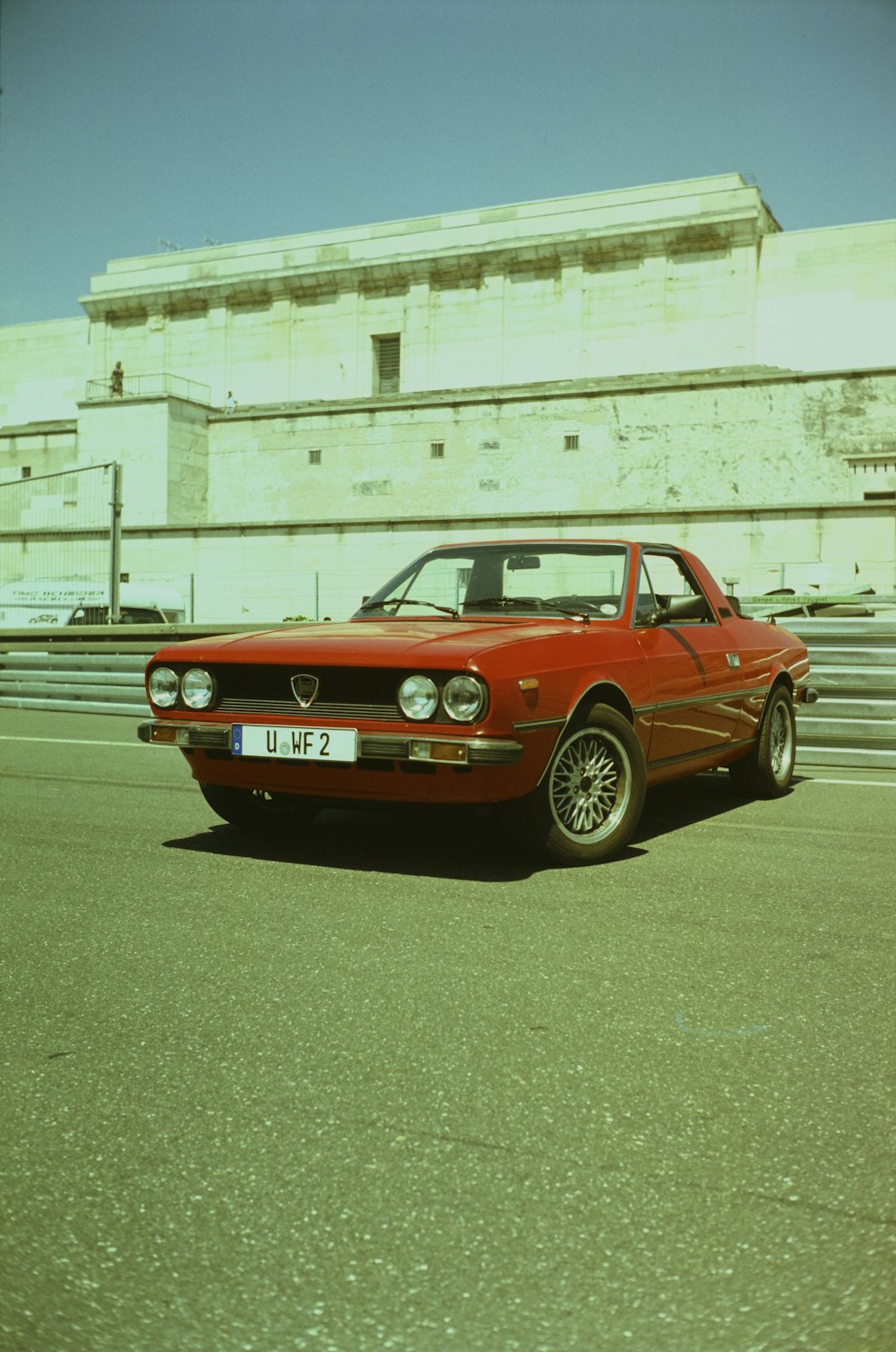 a red car parked on the side of the road