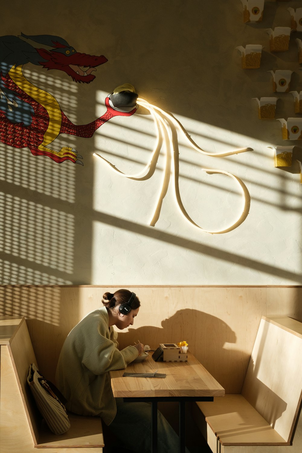 a person sitting at a table in a restaurant