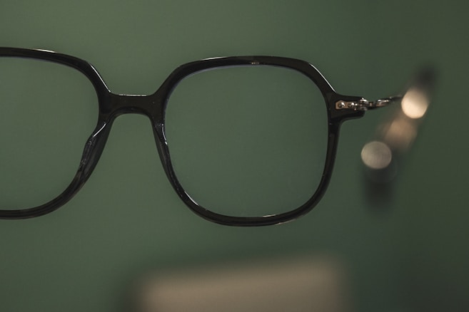 a pair of glasses hanging on a wall