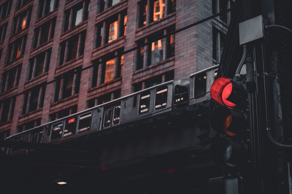 a traffic light with a building in the background