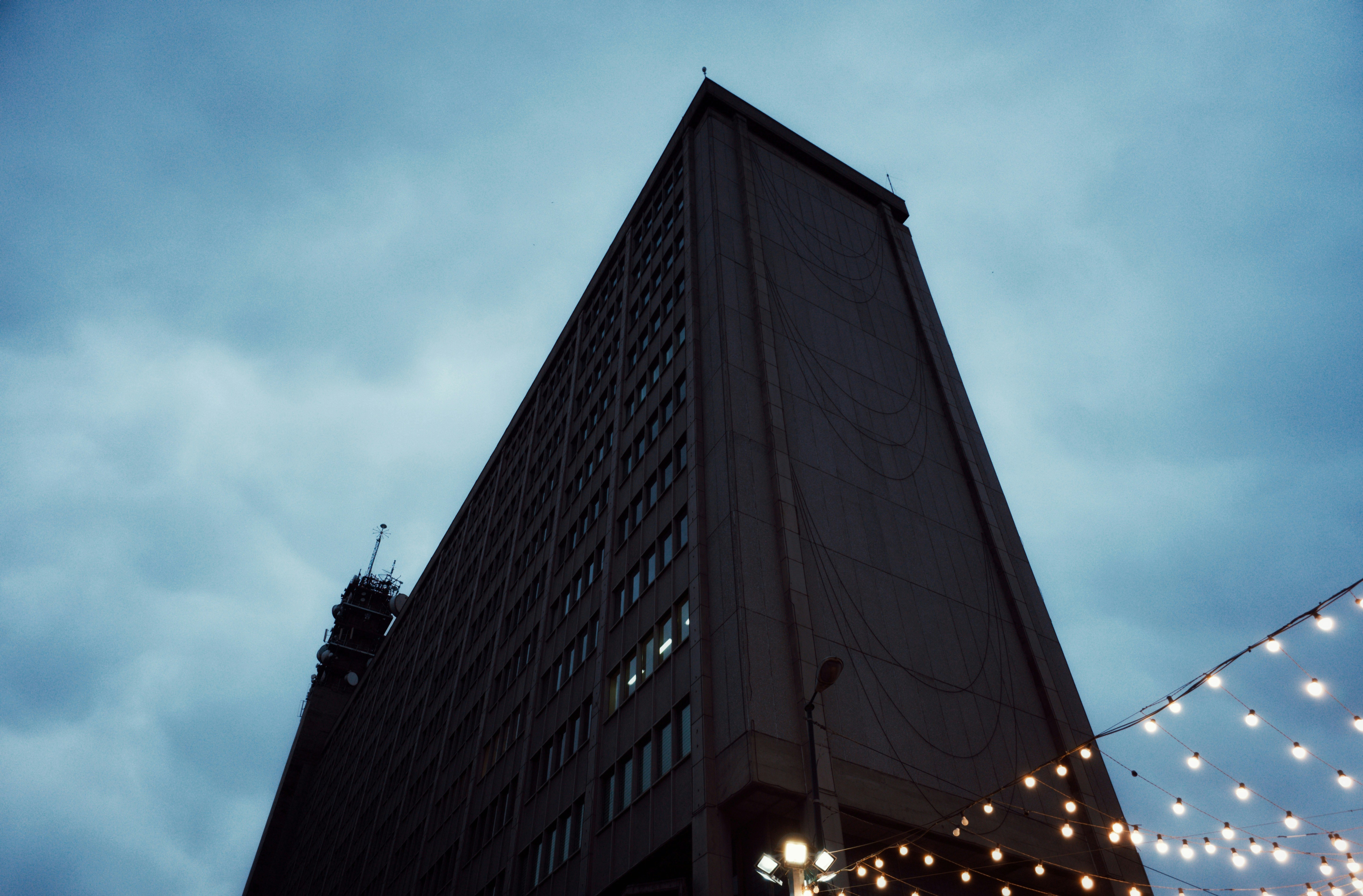 a very tall building with a lot of lights around it