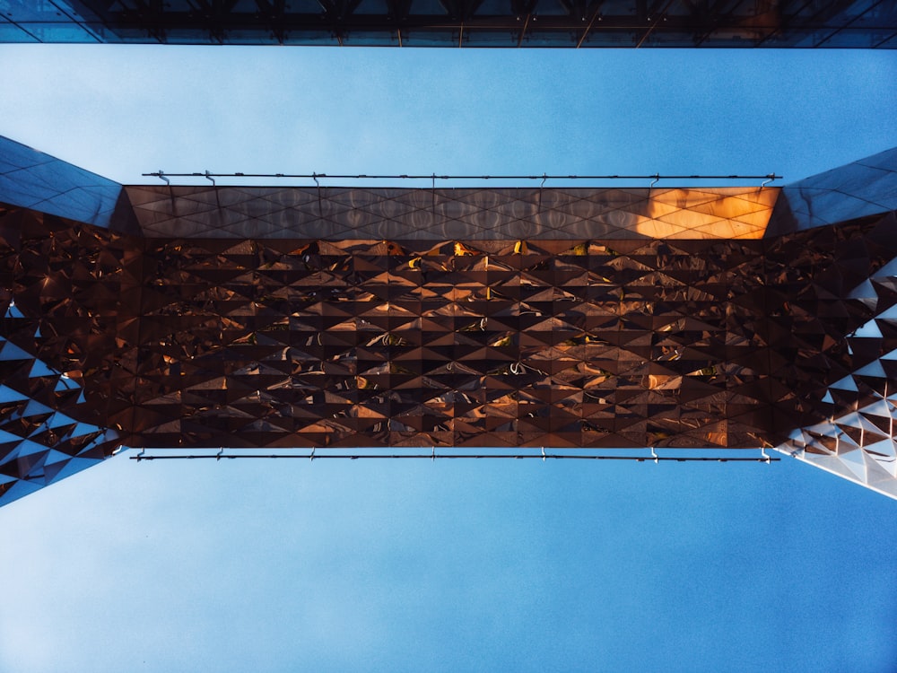 looking up at the top of a tall building