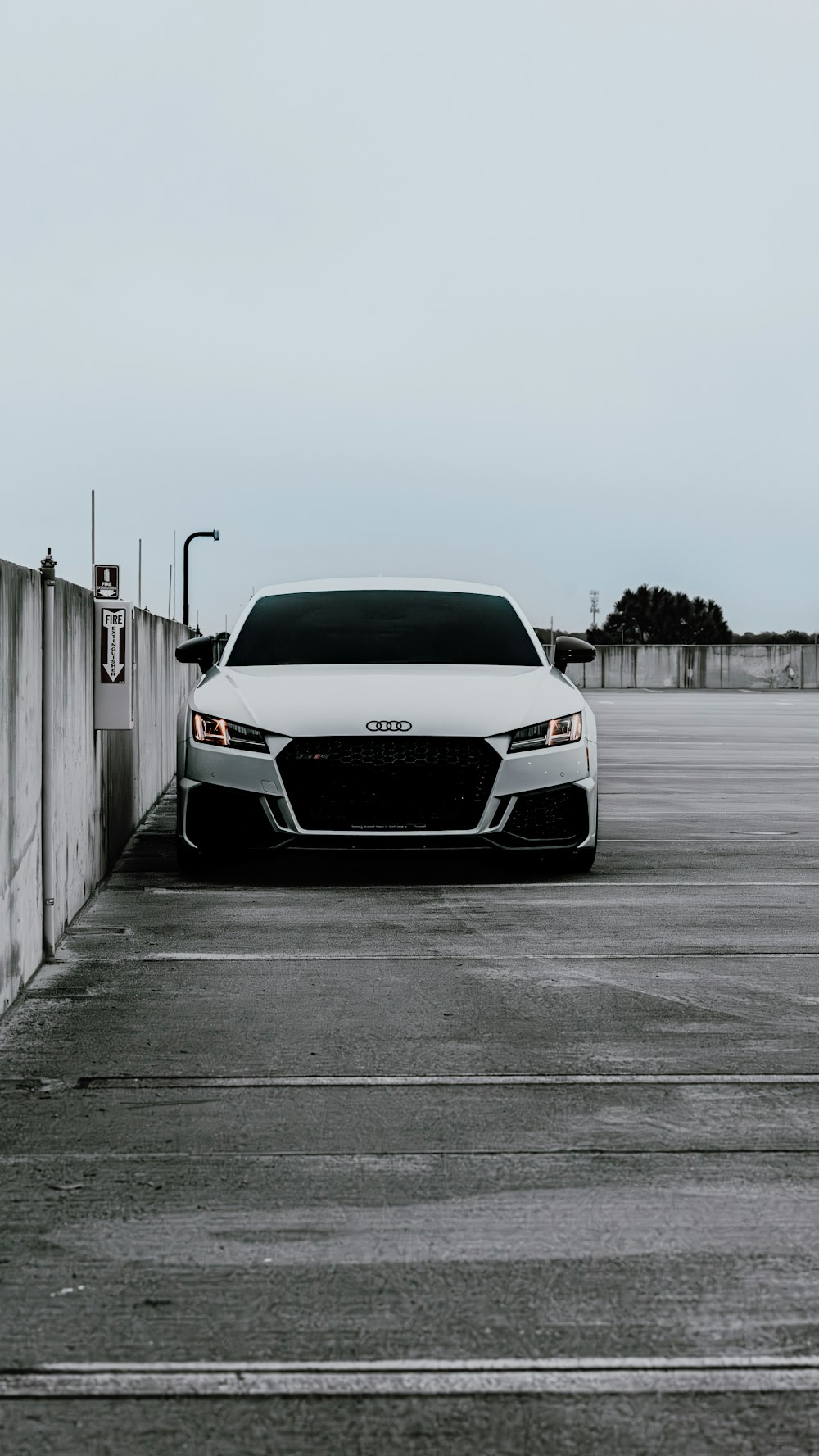 a white car parked in a parking lot