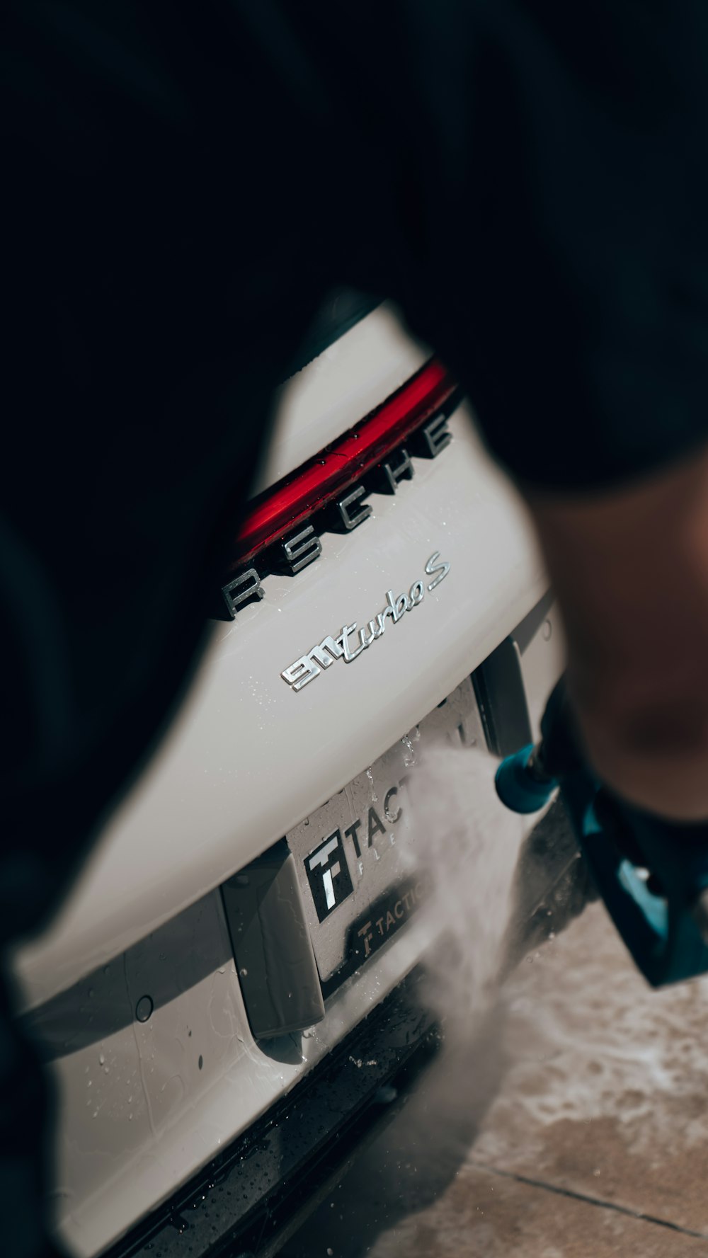 a man is sanding a car with a machine