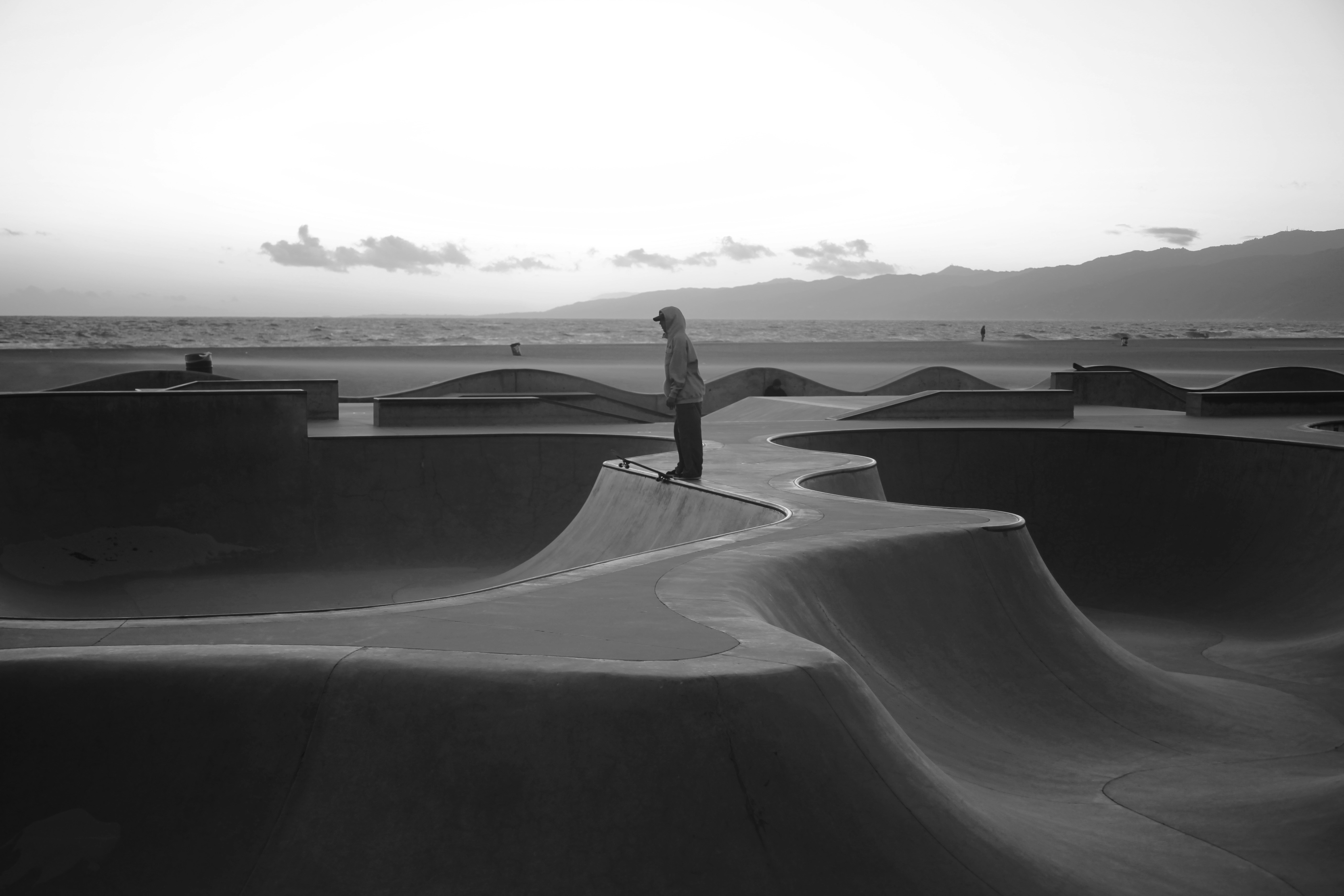 a person riding a skateboard at a skate park, Venice Beach Skatepark