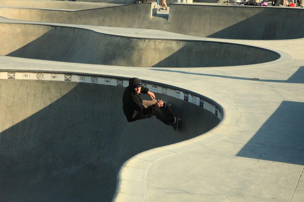 a man riding a skateboard up the side of a ramp