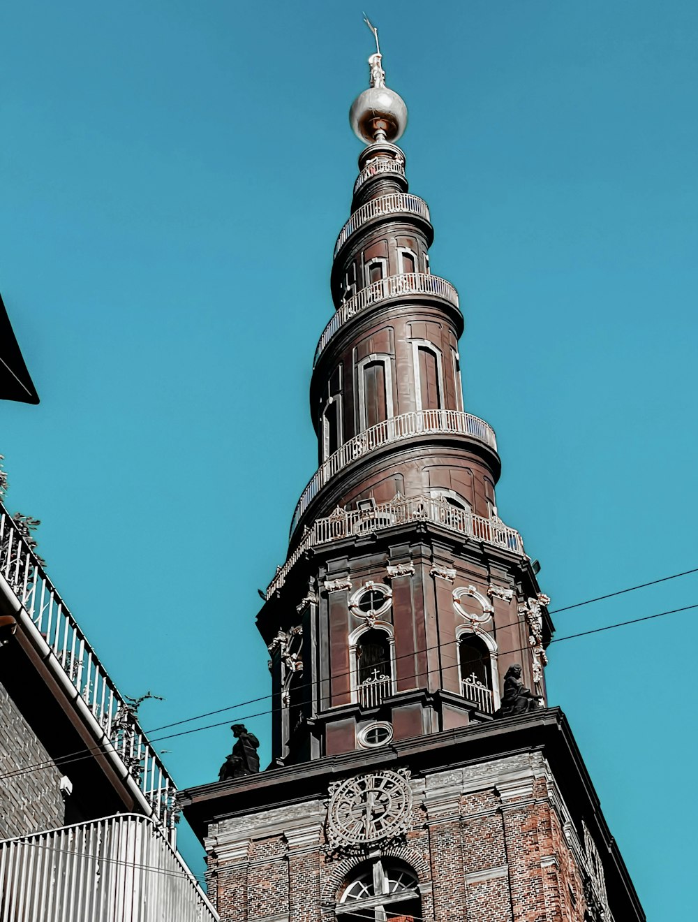 a tall tower with a clock on the top of it