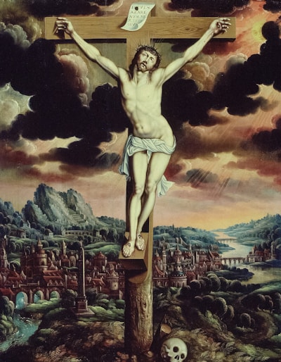 a painting of jesus on the cross with a skull