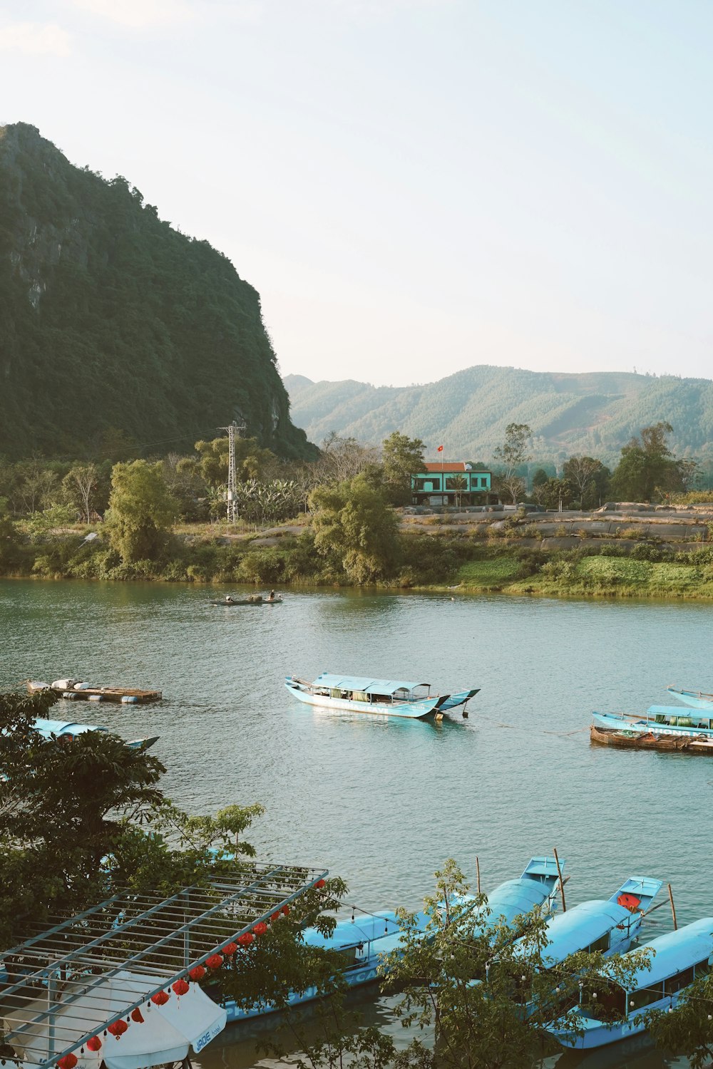 a group of boats floating on top of a lake