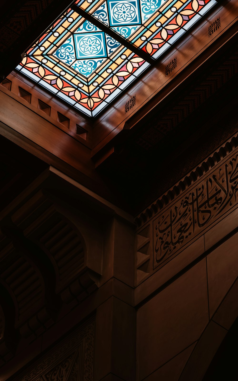 a stained glass window in the ceiling of a building