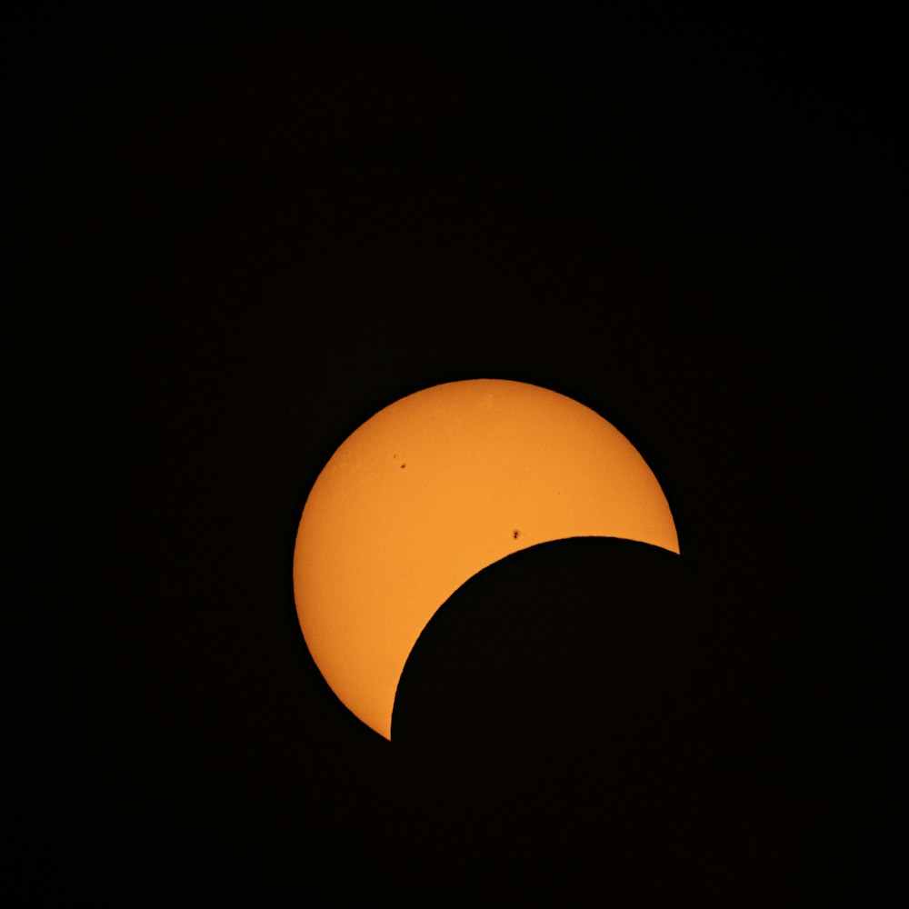 a partial solar eclipse seen through a telescope lens
