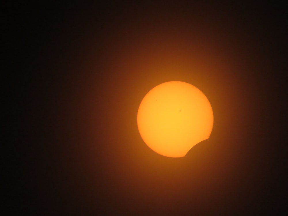 the sun in the dark sky during a solar eclipse