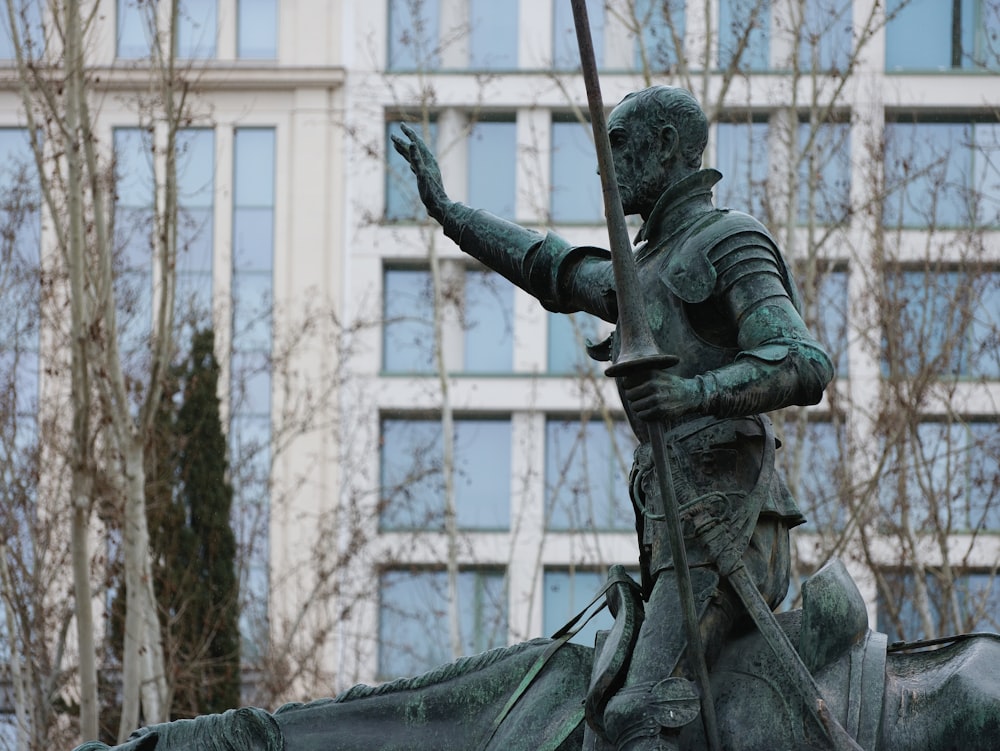 a statue of a man riding on the back of a horse