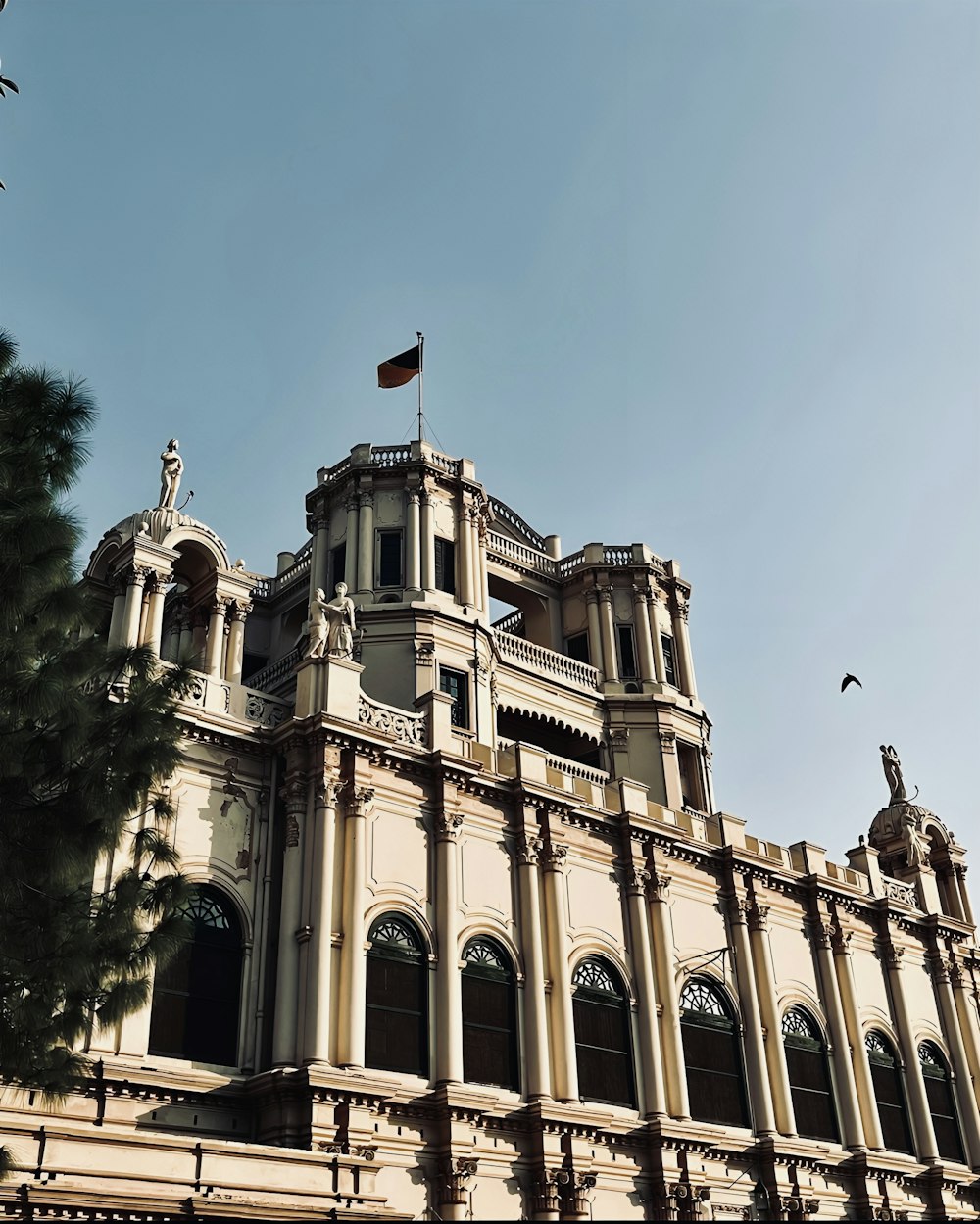 a large building with a flag on top of it