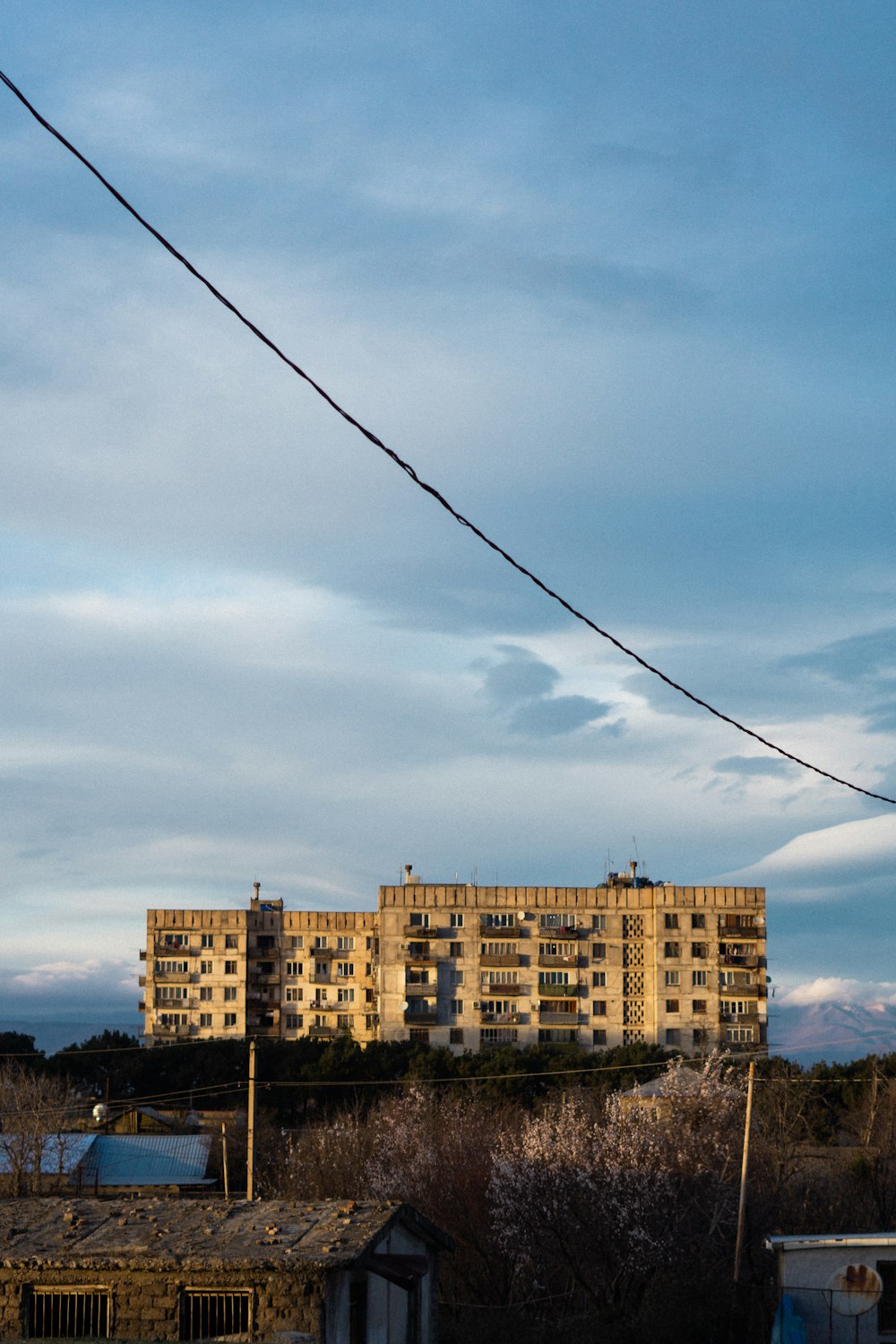 an old building with a power line in front of it