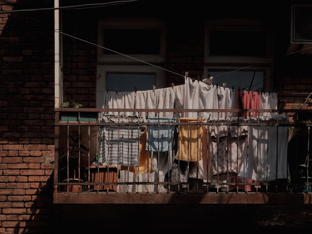 clothes hanging out to dry on a balcony