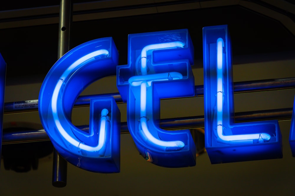 a blue neon sign that reads intel on it