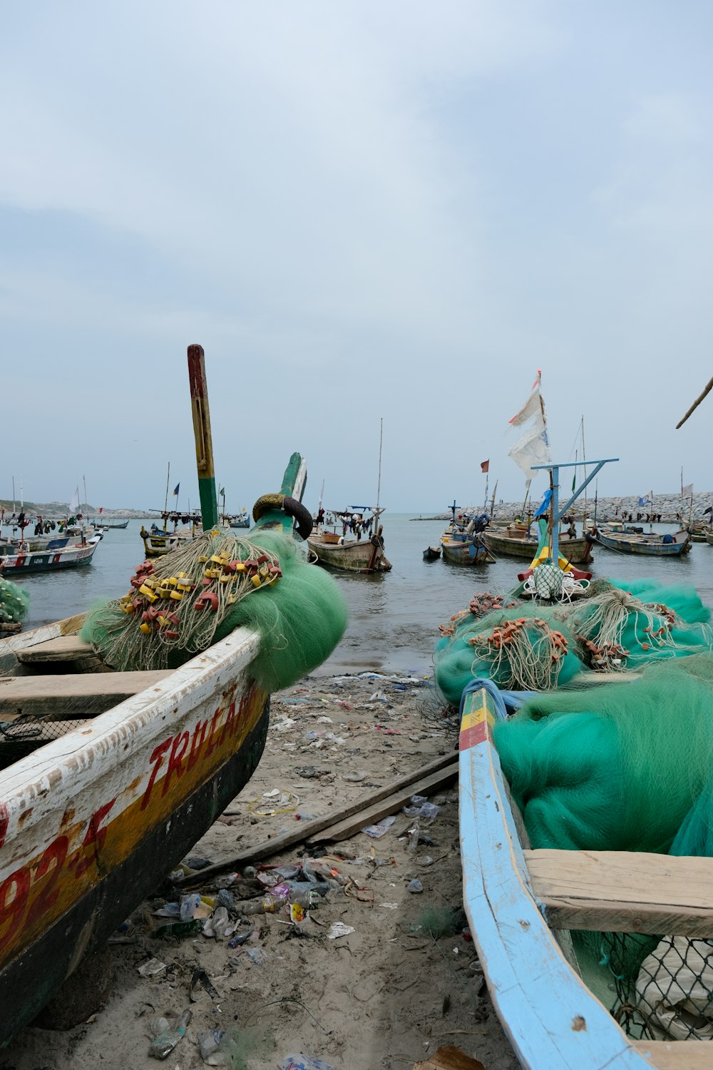 a group of boats sitting on top of a beach