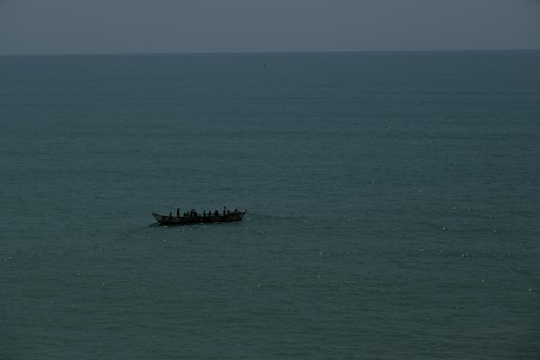 A canoe far out on the sea — Cape Coast, Ghana