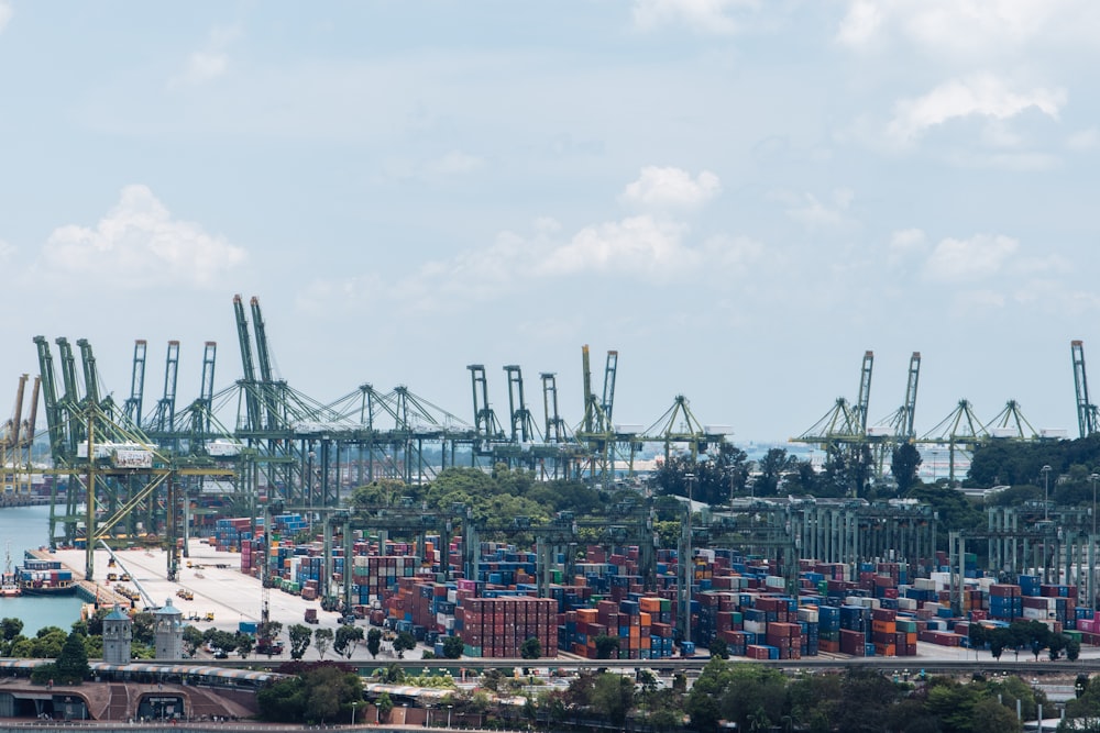 a harbor filled with lots of containers and cranes