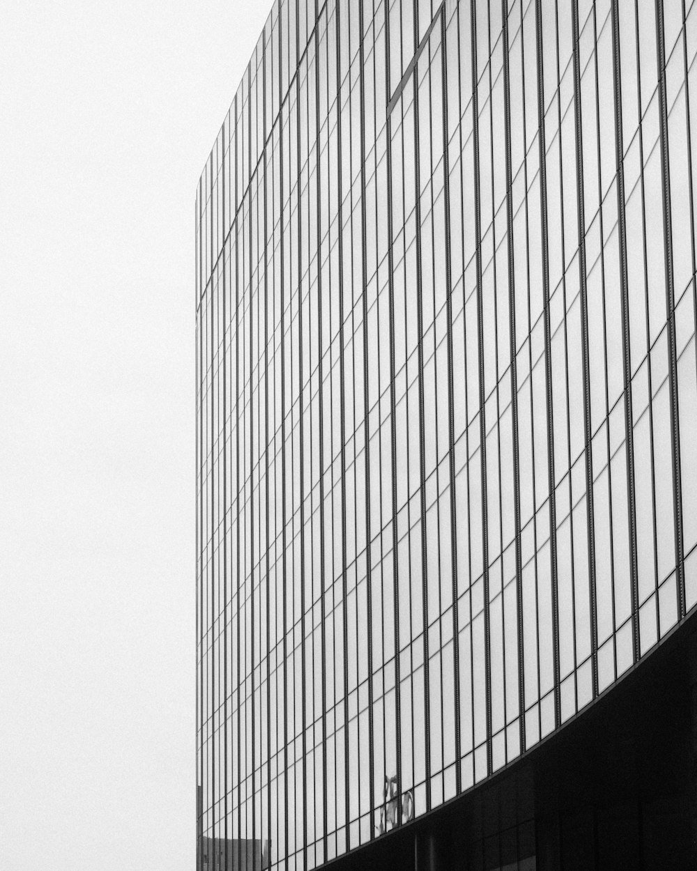 a black and white photo of a tall building