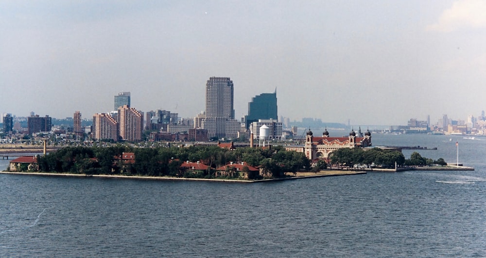 a large body of water with a city in the background