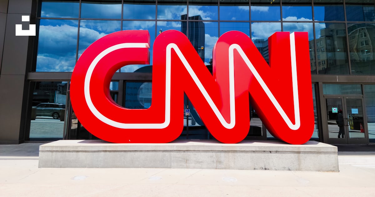 The cnn logo is displayed in front of a building photo – Free Atlanta ...