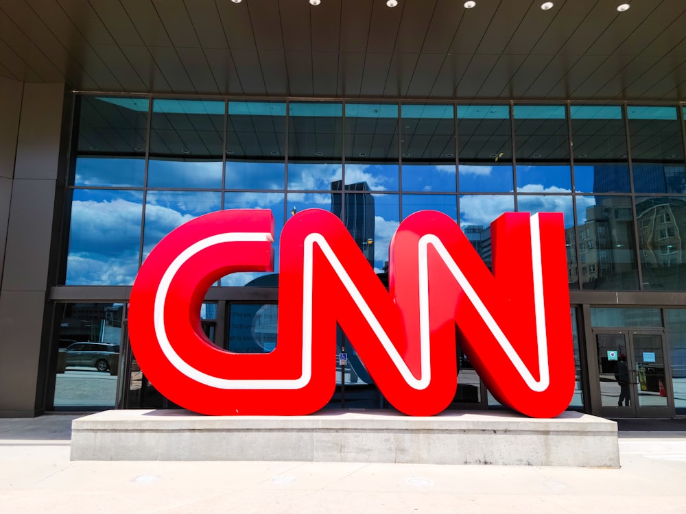 the cnn logo is displayed in front of a building