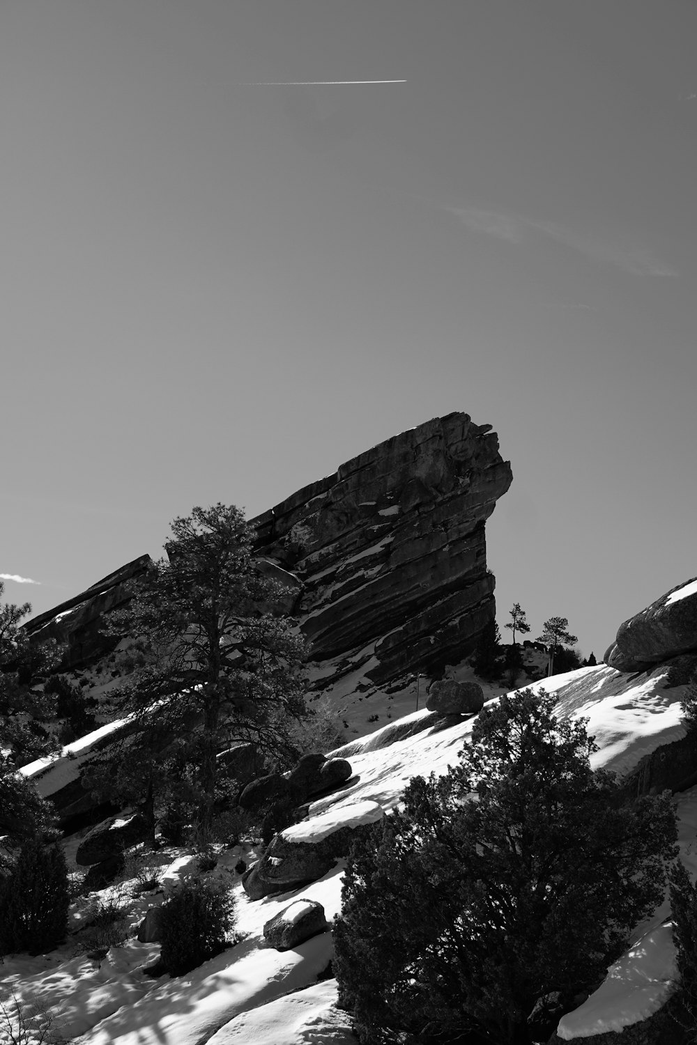 a black and white photo of a rock formation