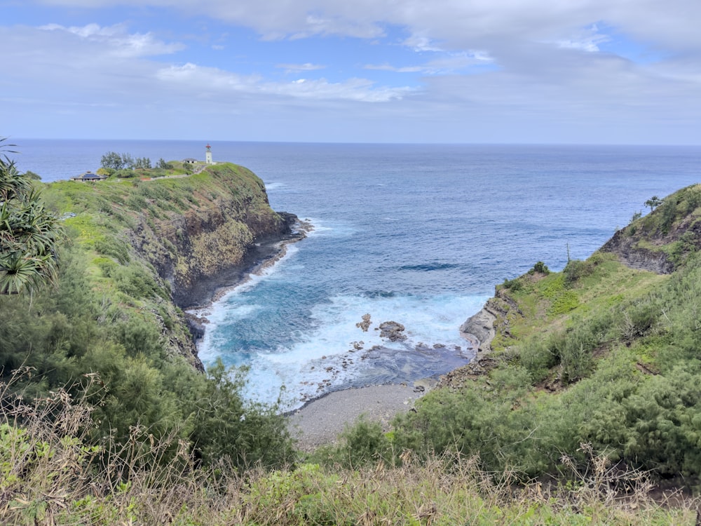 a view of the ocean from the top of a hill