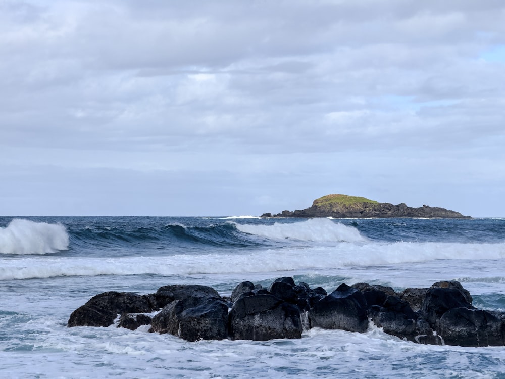 a body of water with waves coming in and out of it