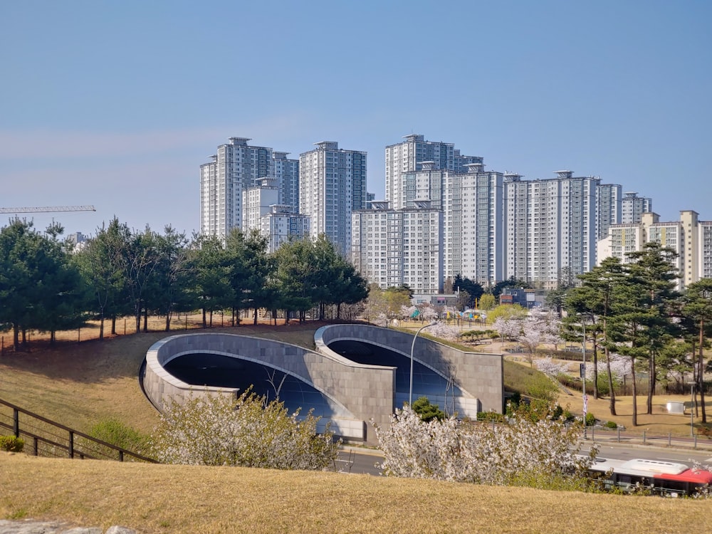 a city skyline with tall buildings in the background