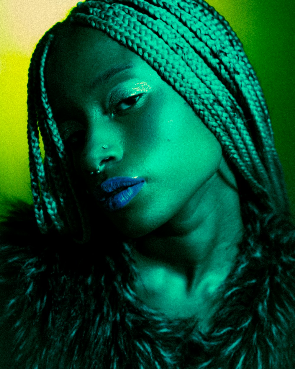 a woman with a blue lipstick and a green background