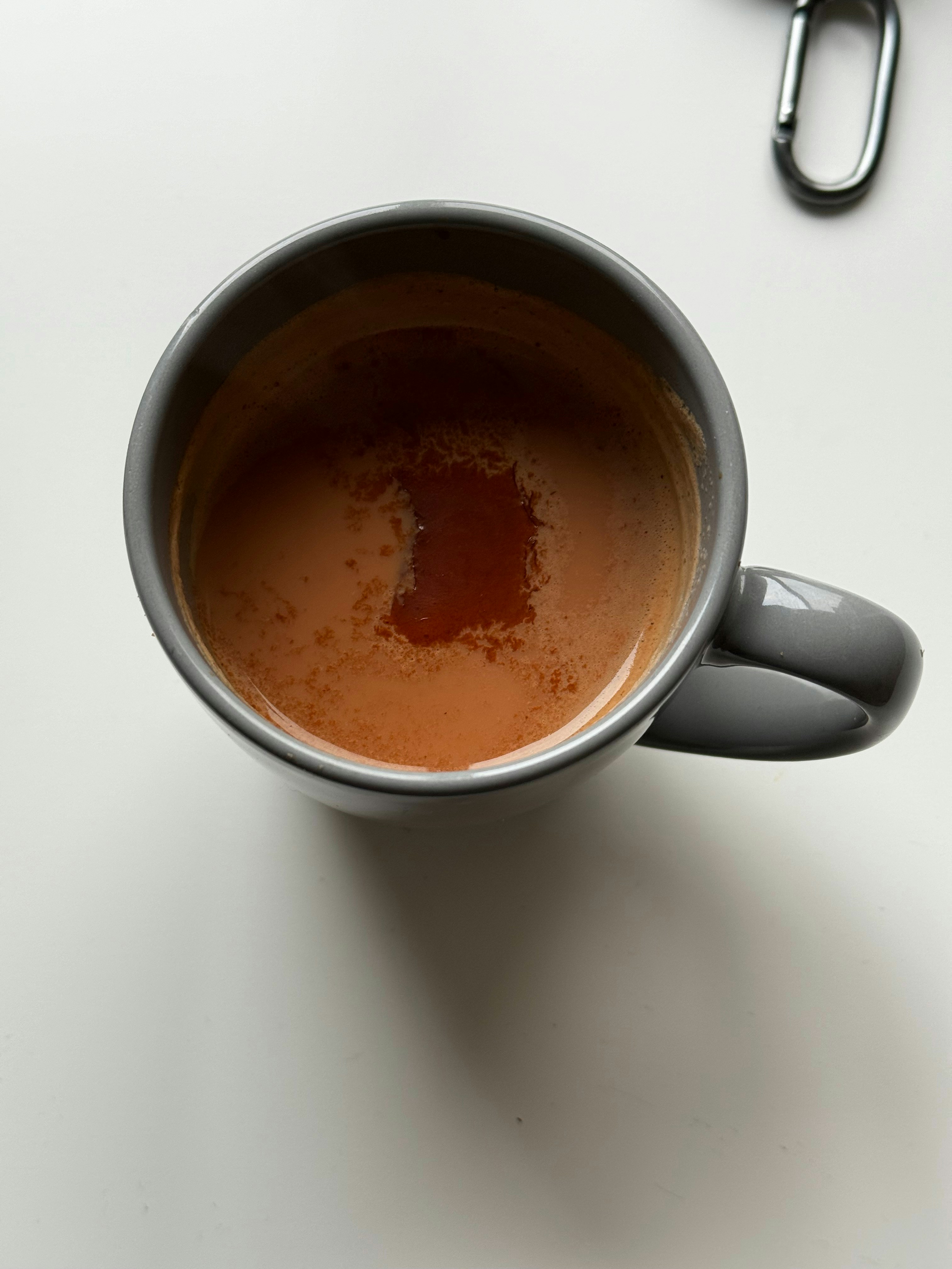 Hot coffee in a glass mug with rich brown color