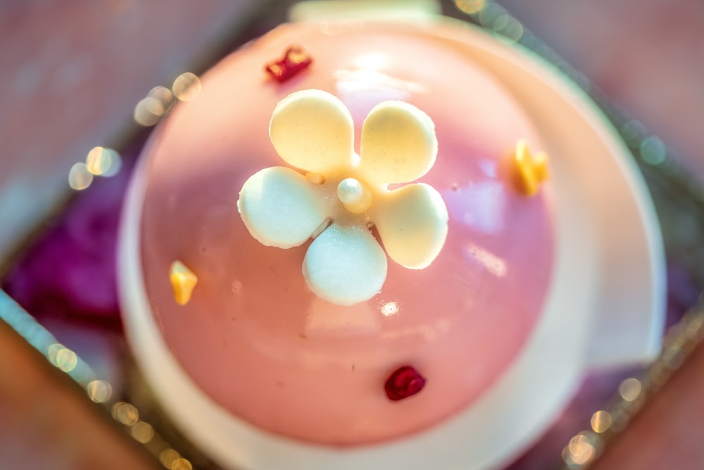 a close up of a cake with white flowers on it