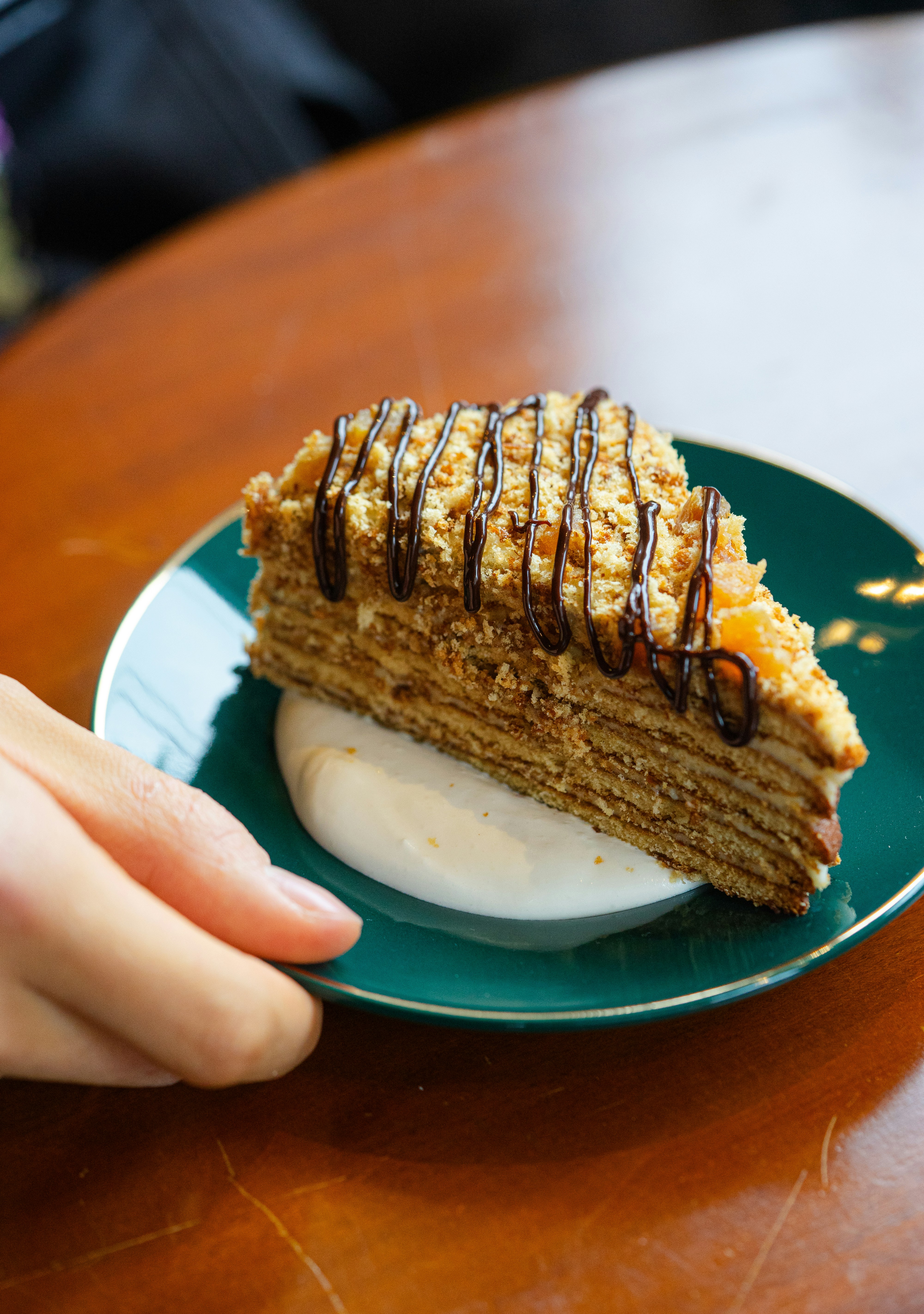 a piece of cake sitting on top of a green plate