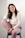 a woman sitting on a chair posing for a picture