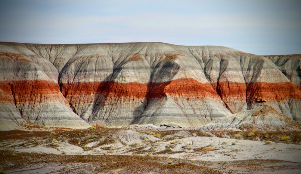 a view of a mountain with a red and white stripe on it