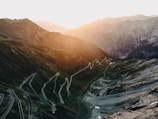 a view of a winding road in the mountains