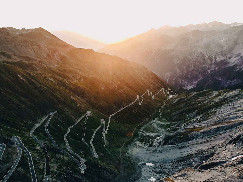 a view of a winding road in the mountains