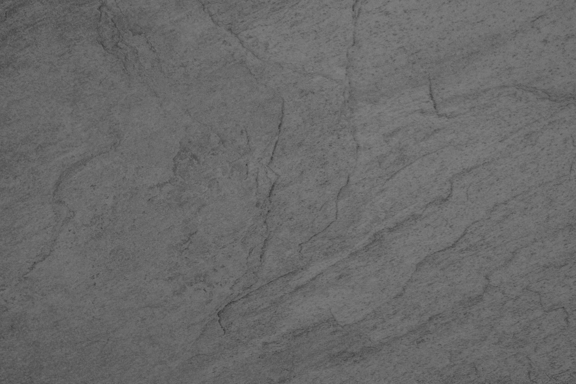 a black and white photo of a marble surface