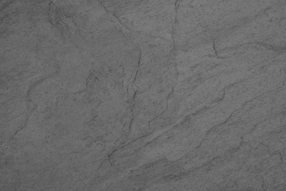 a black and white photo of a marble surface
