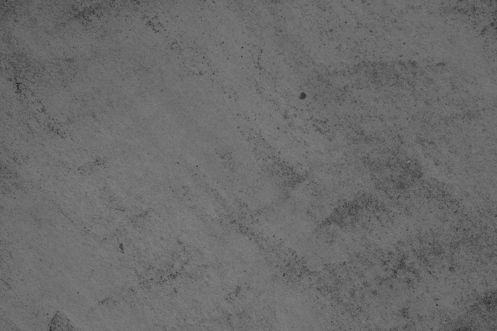 a black and white photo of a concrete surface