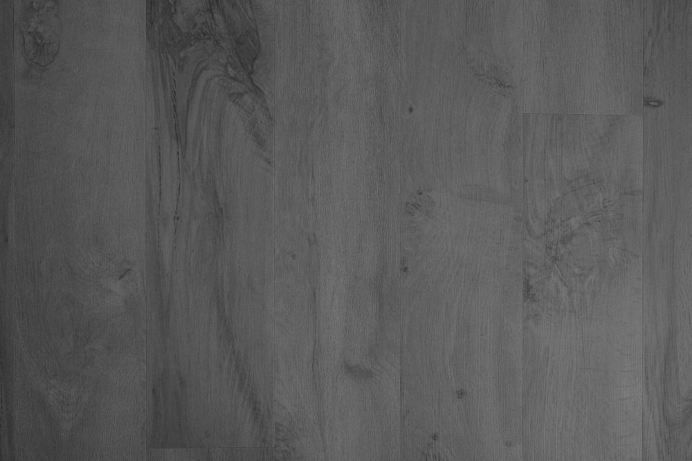 a black and white photo of a wood floor