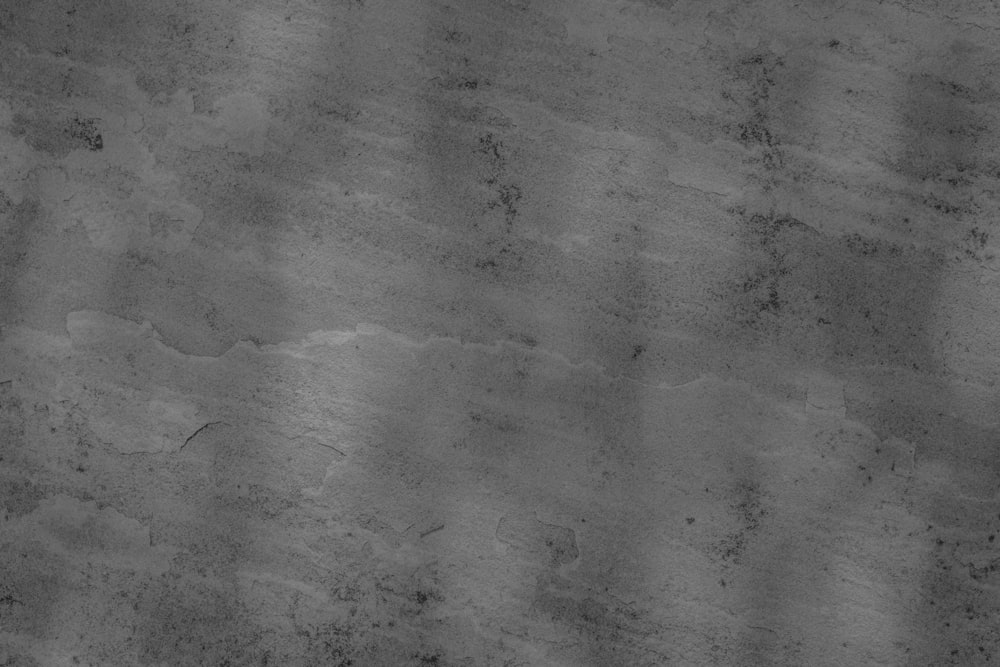 a black and white photo of a skateboarder doing a trick