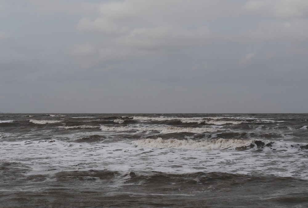 a large body of water with waves coming in