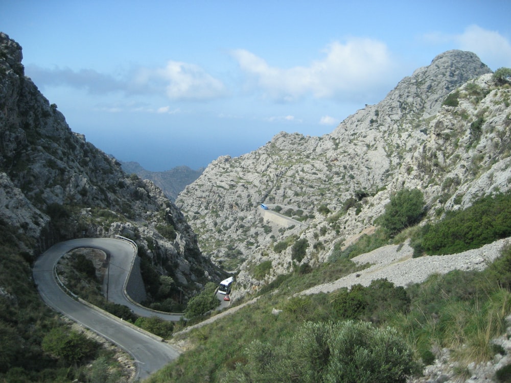 a car driving down a winding mountain road