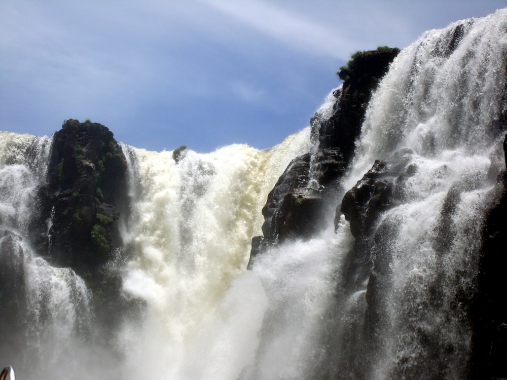 a large waterfall with lots of water coming out of it